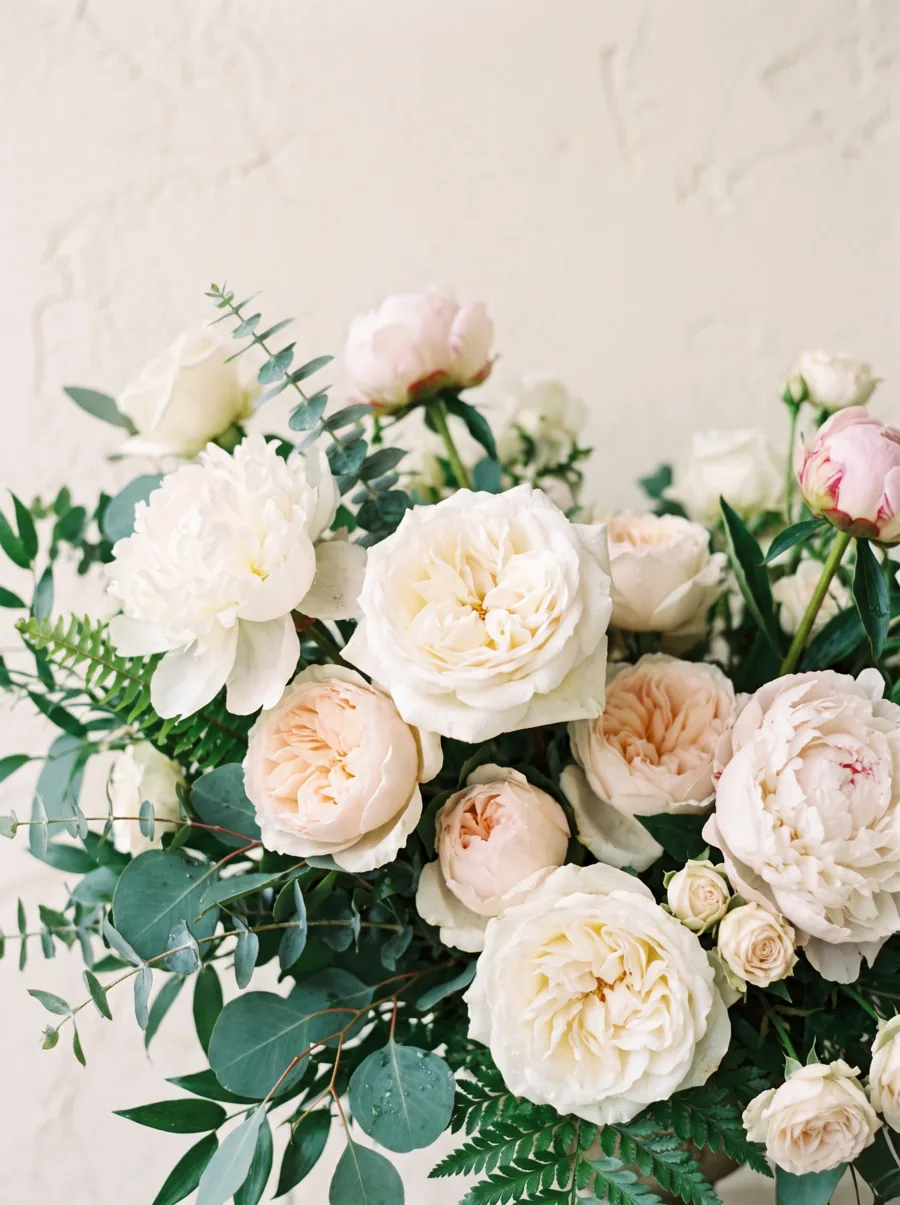 Lush floral arrangement with roses and greenery